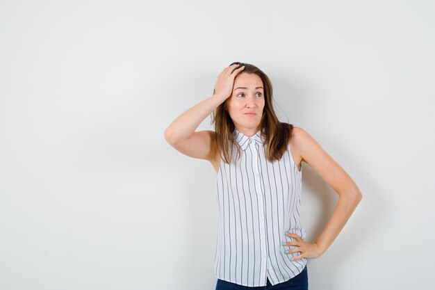 Expressive young lady posing in the studio