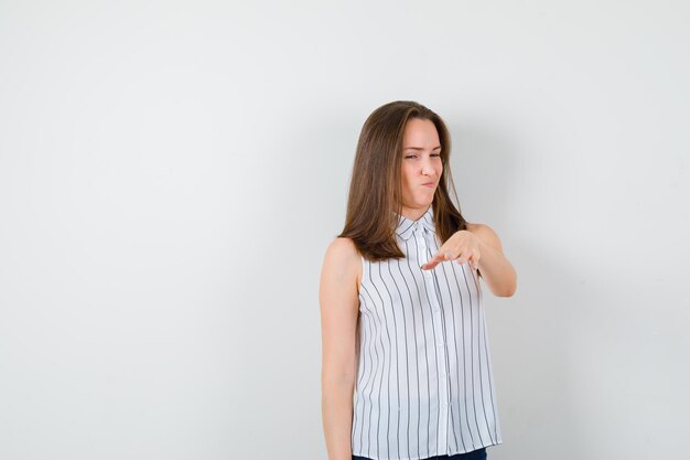 Expressive young lady posing in the studio