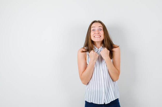 Expressive young lady posing in the studio