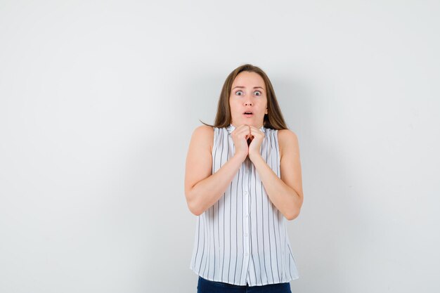 Expressive young lady posing in the studio