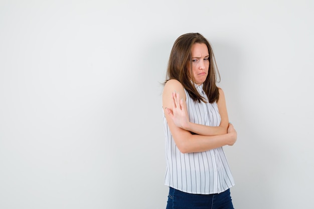 Expressive young lady posing in the studio