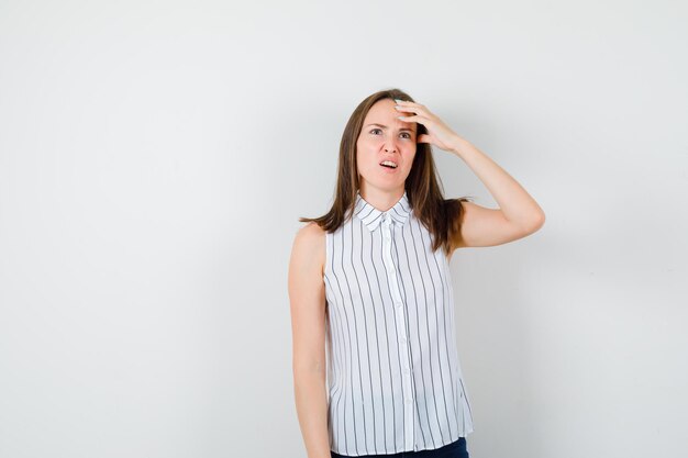 Expressive young lady posing in the studio