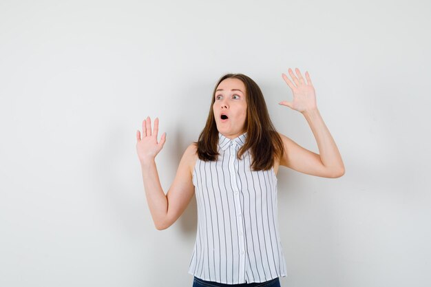 Expressive young lady posing in the studio