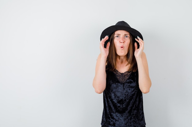 Expressive young lady posing in the studio