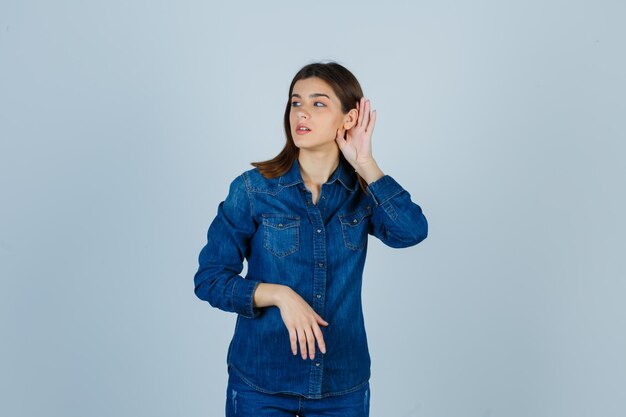 Expressive young lady posing in the studio