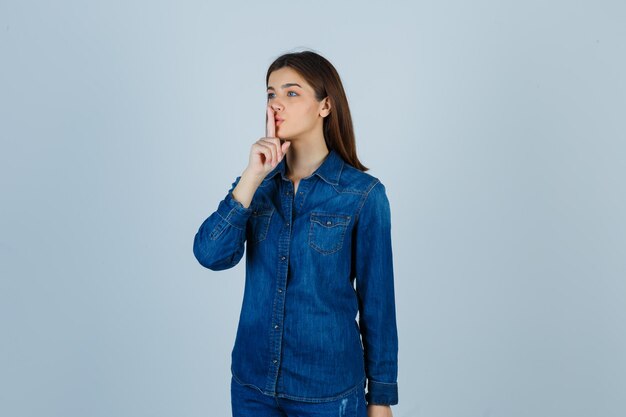 Expressive young lady posing in the studio