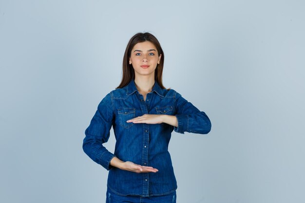 Expressive young lady posing in the studio