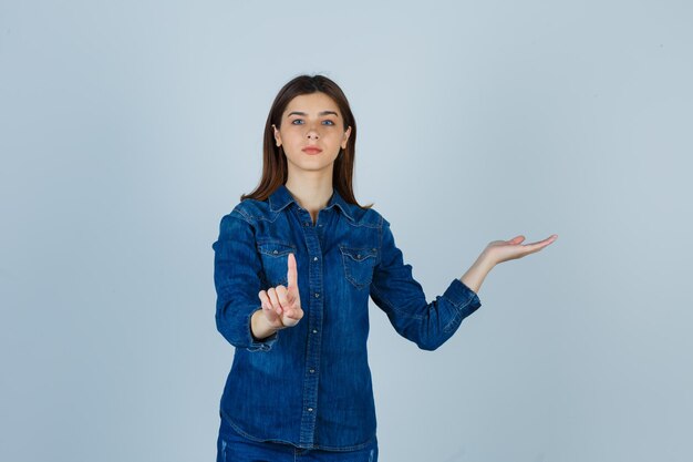 Expressive young lady posing in the studio