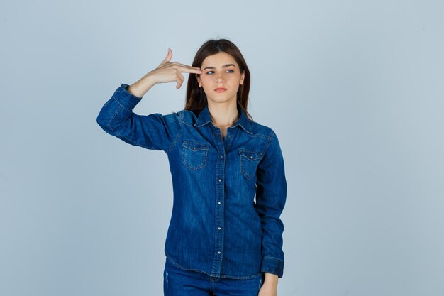 Expressive young lady posing in the studio