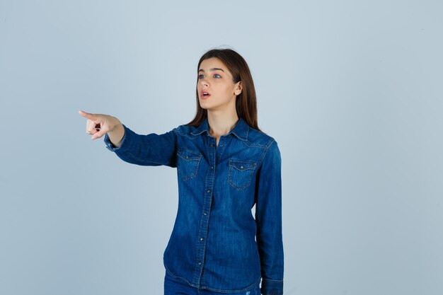 Expressive young lady posing in the studio