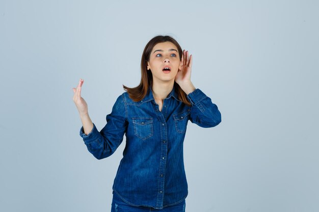 Expressive young lady posing in the studio