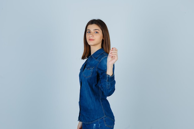 Expressive young lady posing in the studio