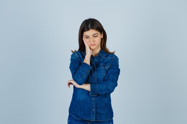 Expressive young lady posing in the studio