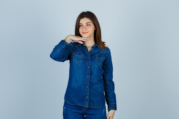 Expressive young lady posing in the studio