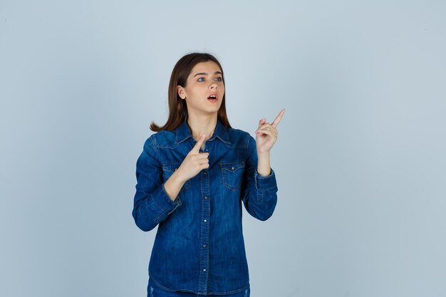 Expressive young lady posing in the studio