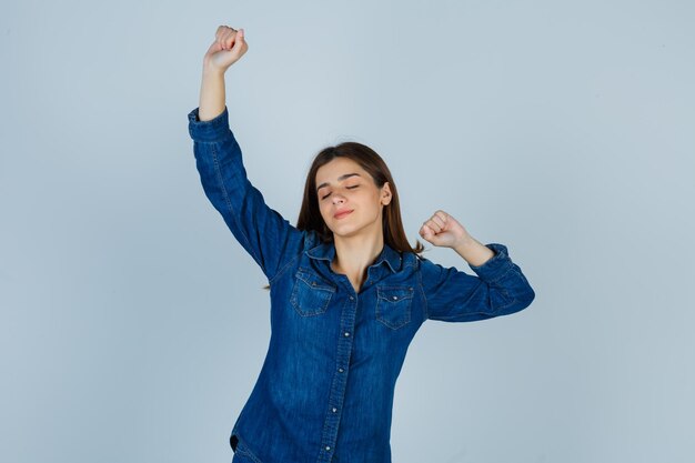 Expressive young lady posing in the studio