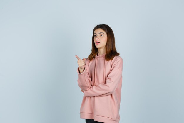 Expressive young lady posing in the studio