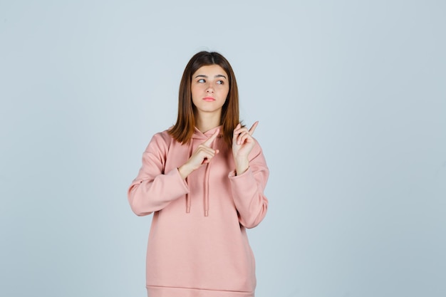 Expressive young lady posing in the studio