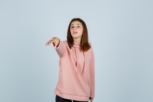 Expressive young lady posing in the studio