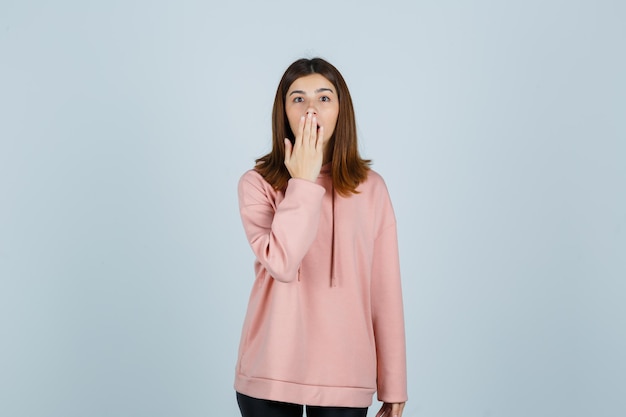 Expressive young lady posing in the studio