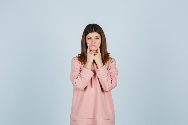 Expressive young lady posing in the studio