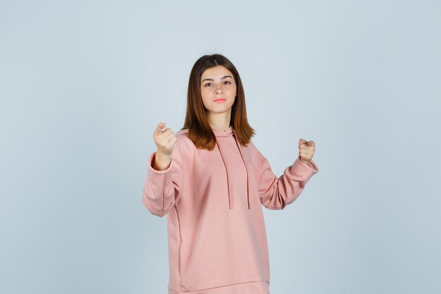 Expressive young lady posing in the studio