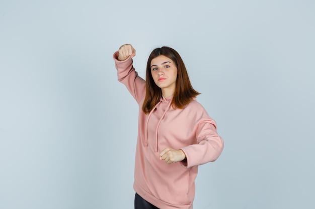 Expressive young lady posing in the studio