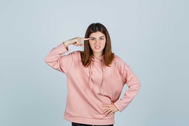 Expressive young lady posing in the studio