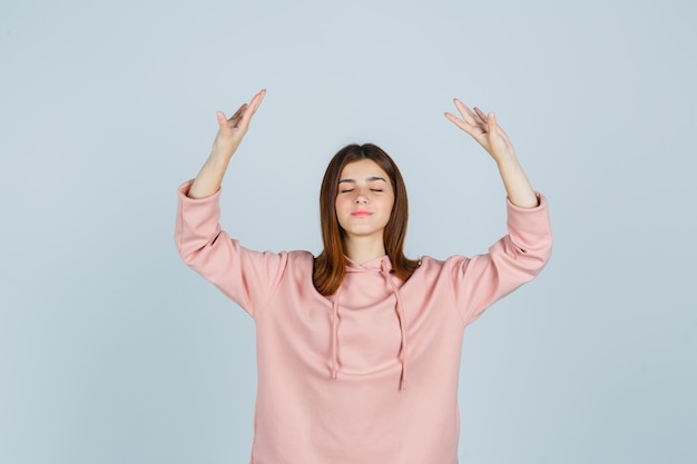 Expressive young lady posing in the studio