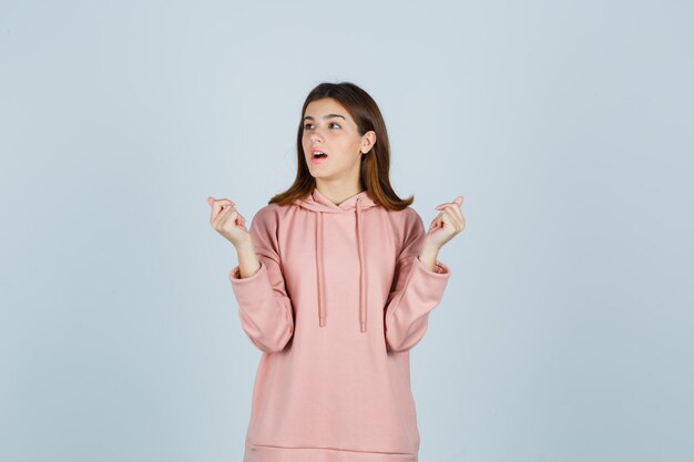 Expressive young lady posing in the studio