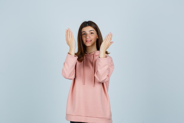 Expressive young lady posing in the studio