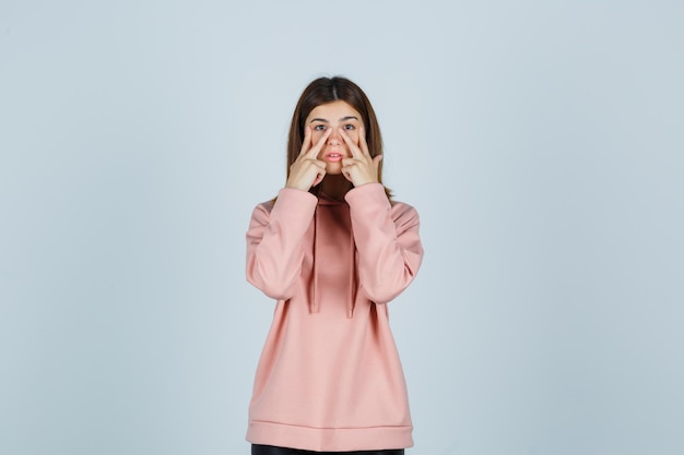 Expressive young lady posing in the studio