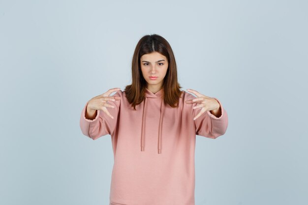 Expressive young lady posing in the studio