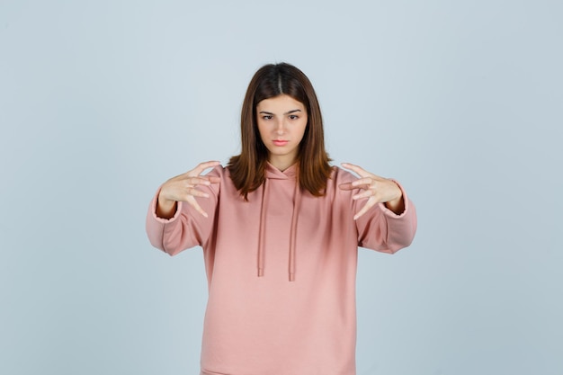 Expressive young lady posing in the studio