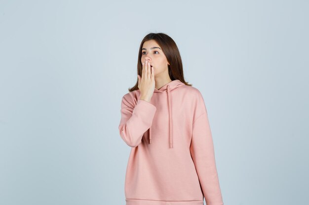 Expressive young lady posing in the studio