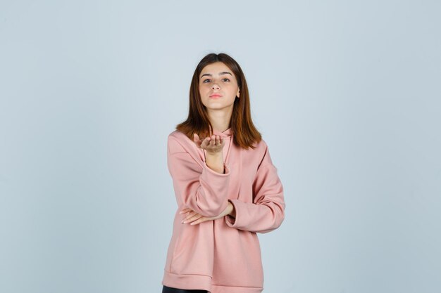 Expressive young lady posing in the studio