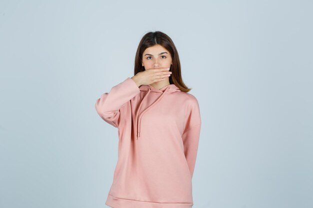 Expressive young lady posing in the studio