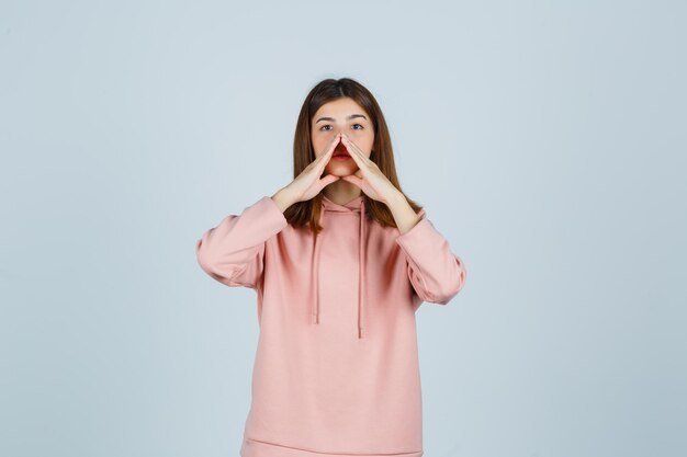 Expressive young lady posing in the studio