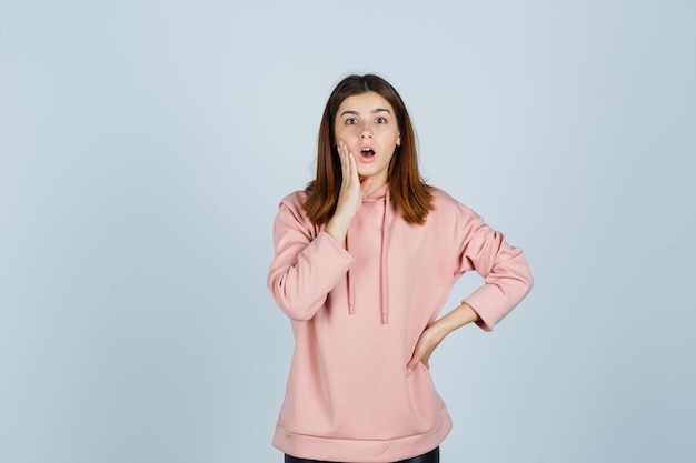 Expressive young lady posing in the studio