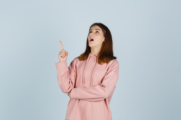 Expressive young lady posing in the studio