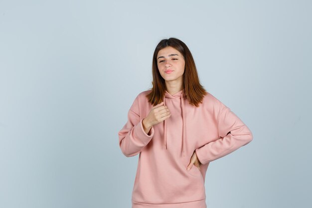 Expressive young lady posing in the studio