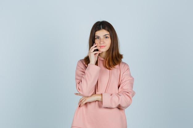 Expressive young lady posing in the studio