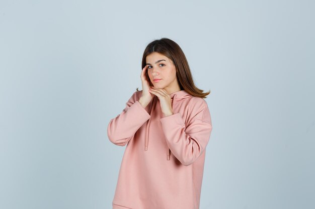 Expressive young lady posing in the studio