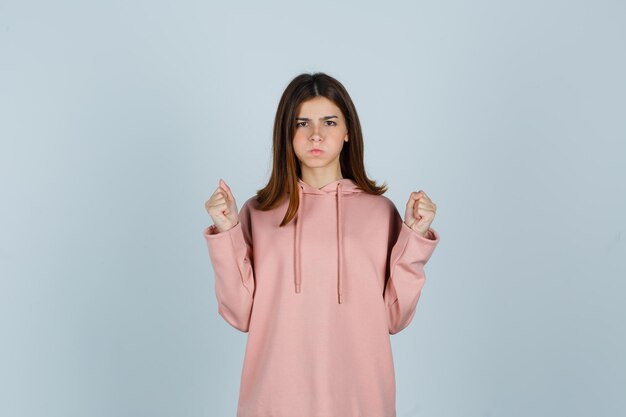 Expressive young lady posing in the studio