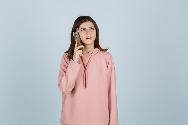 Expressive young lady posing in the studio