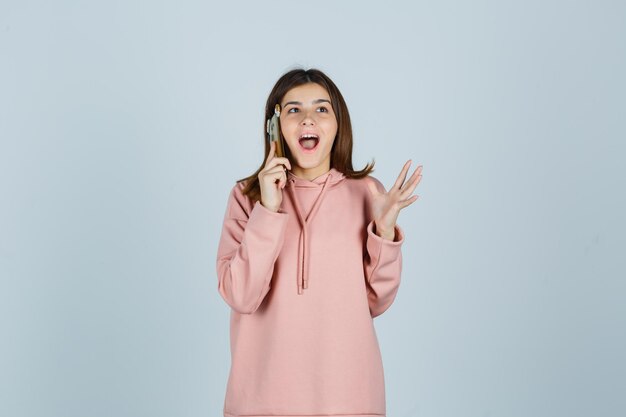 Expressive young lady posing in the studio