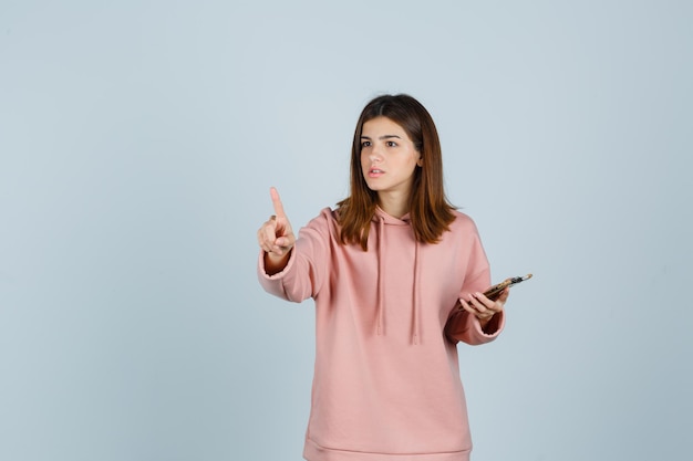 Expressive young lady posing in the studio