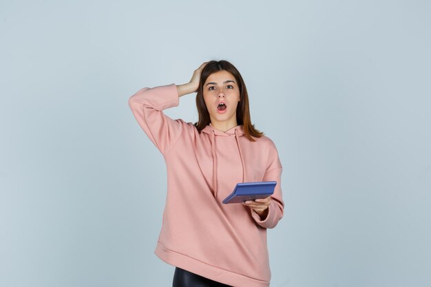 Expressive young lady posing in the studio