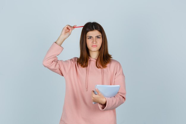 Expressive young lady posing in the studio