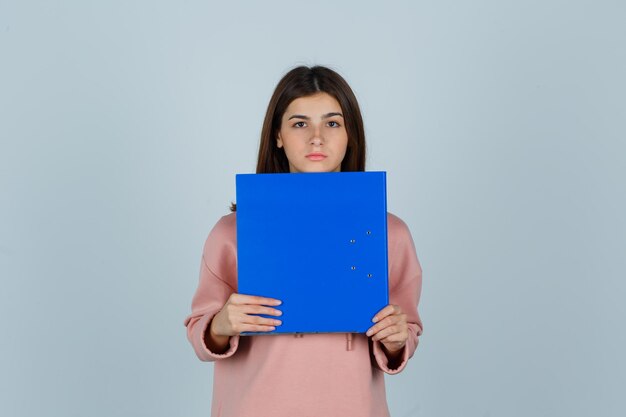 Expressive young lady posing in the studio